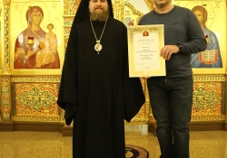 Вечернее богослужение в Богоявлениском храме в день престольного праздника. Награждение